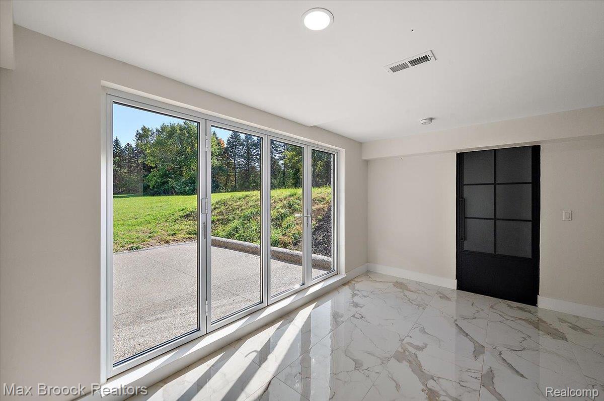 4597 Clarkston Road Clarkston, MI 48348 - Photo 43 of 74 White porcelain tile flooring with grey veining