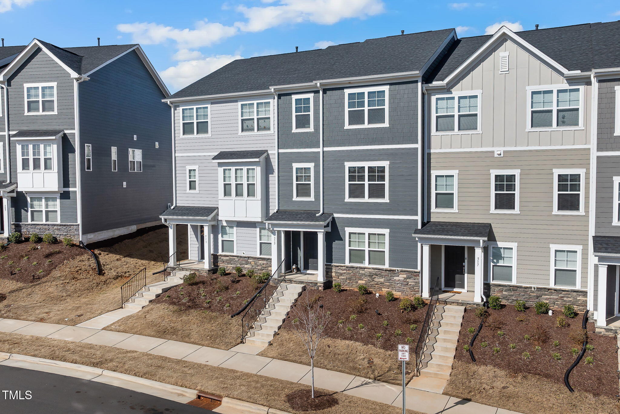 515 Brushford Lane Wake Forest, NC 27587 - Photo 2 of 2 a front view of a residential apartment building with a yard