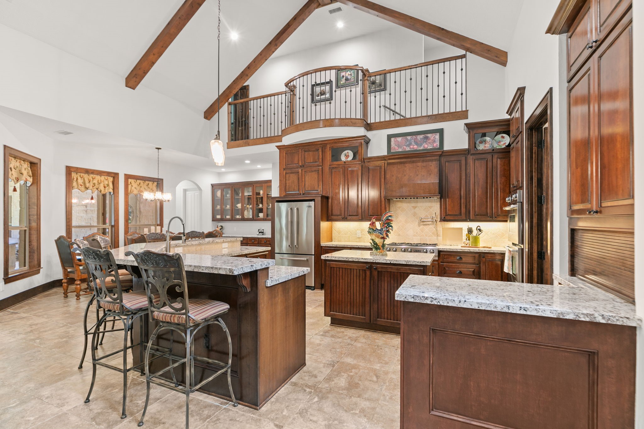 15601 Brown Road Tomball, TX 77377 - Photo 11 of 48 a kitchen with a sink and chairs