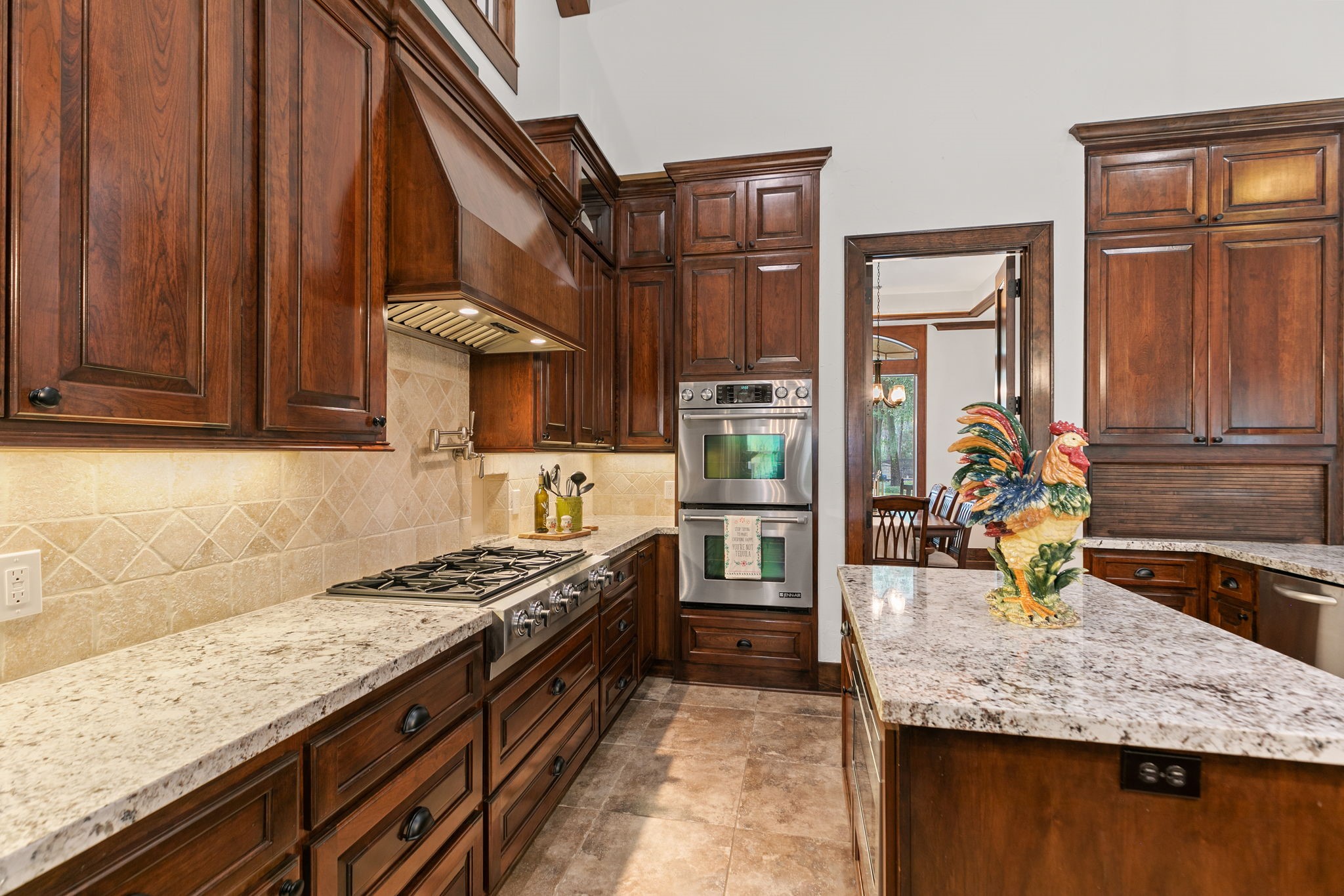 15601 Brown Road Tomball, TX 77377 - Photo 13 of 48 a kitchen with stainless steel appliances granite countertop a stove a sink and a microwave