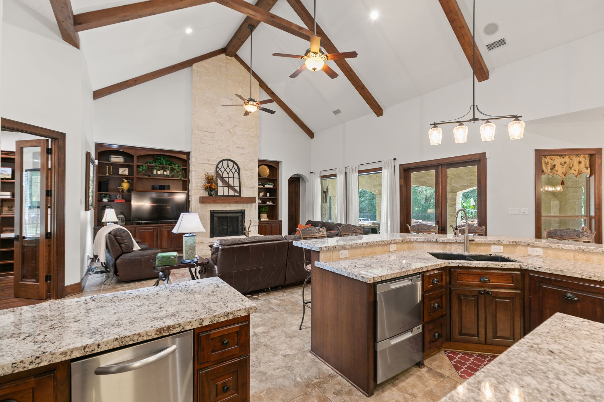15601 Brown Road Tomball, TX 77377 - Photo 14 of 48 a kitchen with stainless steel appliances granite countertop a stove and a sink