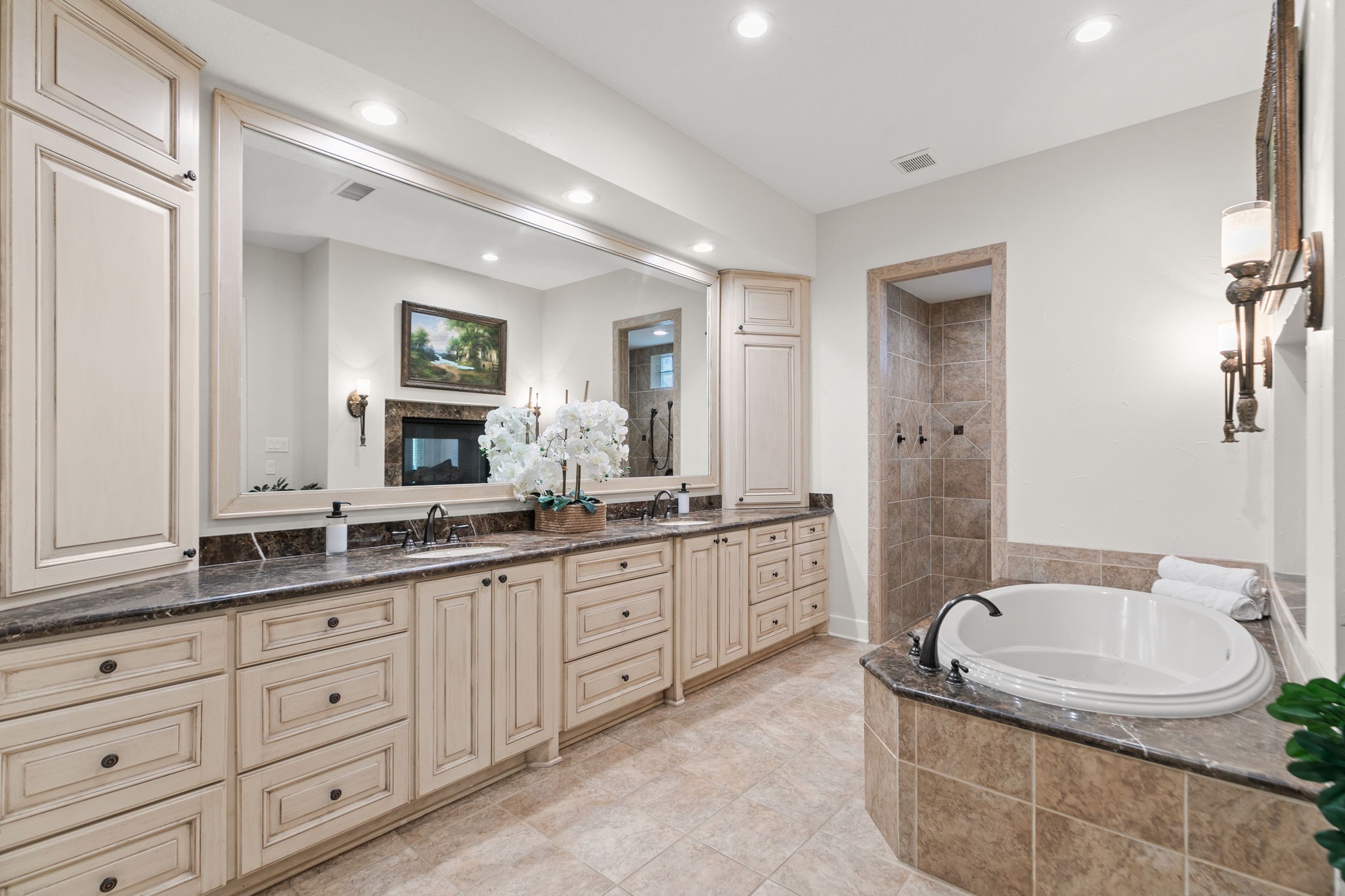 15601 Brown Road Tomball, TX 77377 - Photo 19 of 48 a bathroom with a granite countertop tub sink double vanity granite tub shower and mirror