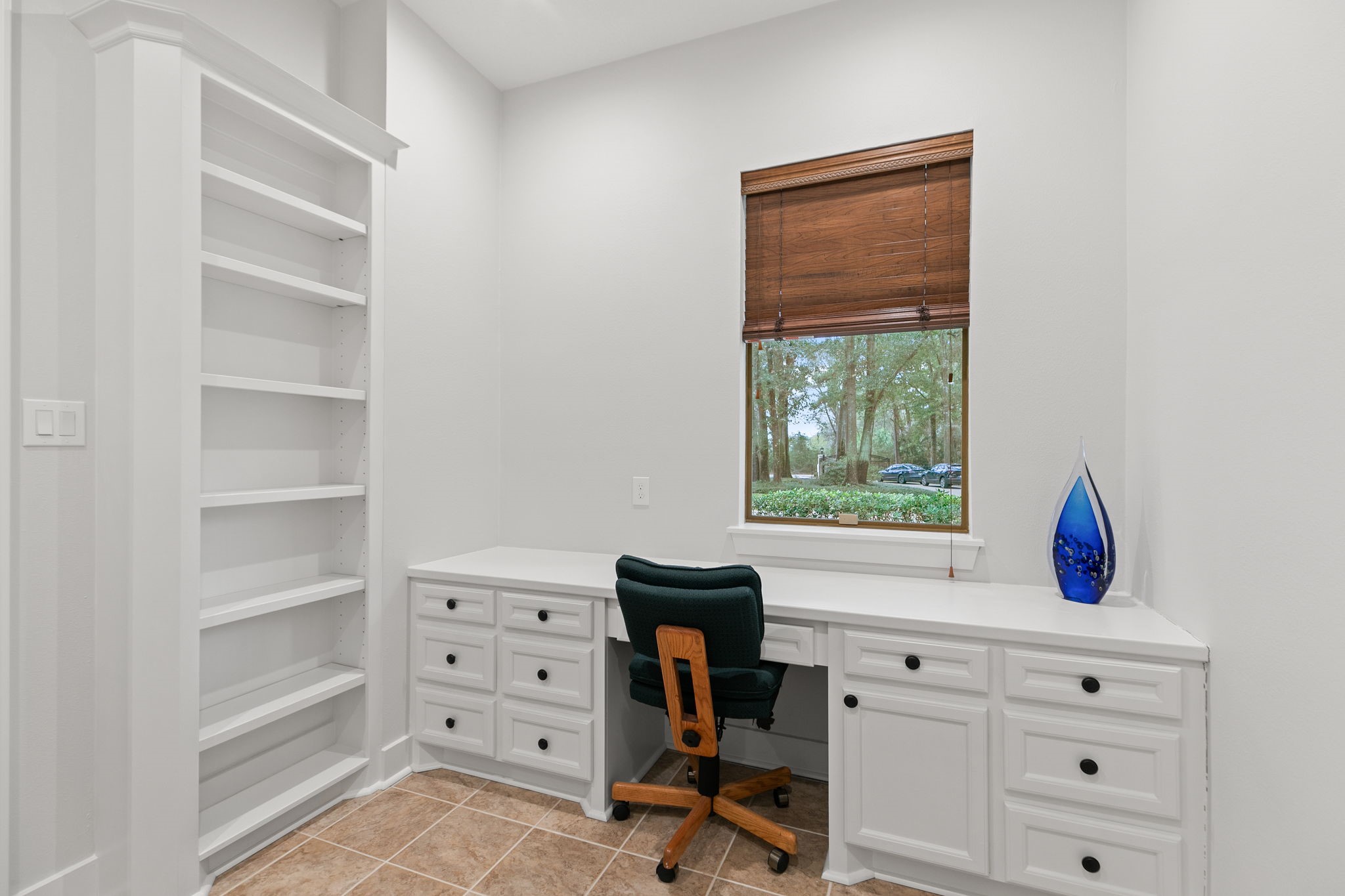 15601 Brown Road Tomball, TX 77377 - Photo 22 of 48 a view of a workspace with furniture and a window