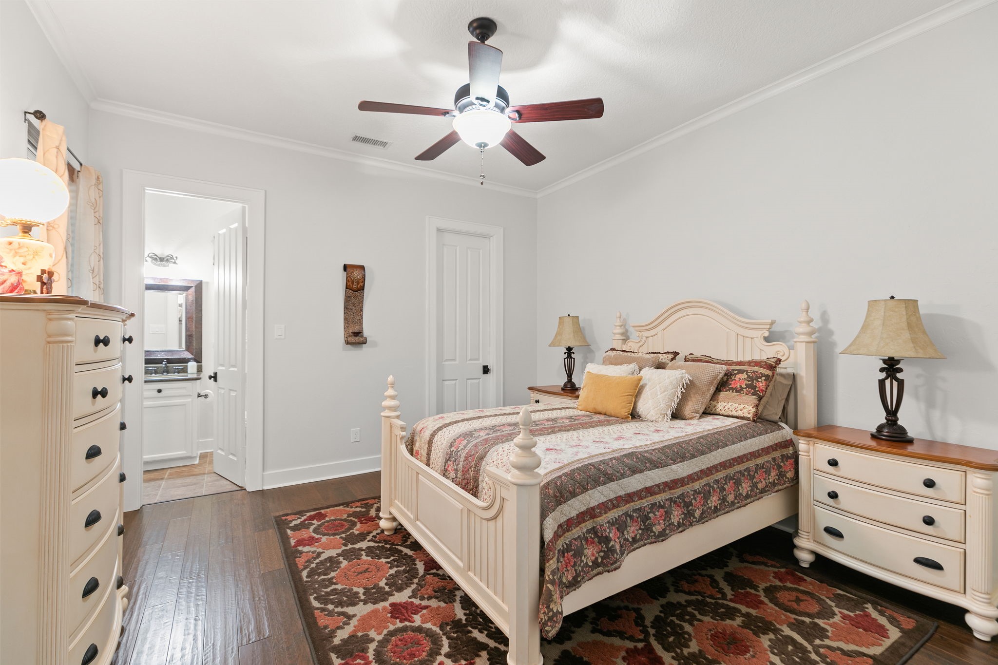 15601 Brown Road Tomball, TX 77377 - Photo 23 of 48 a bedroom with a bed and wooden floor