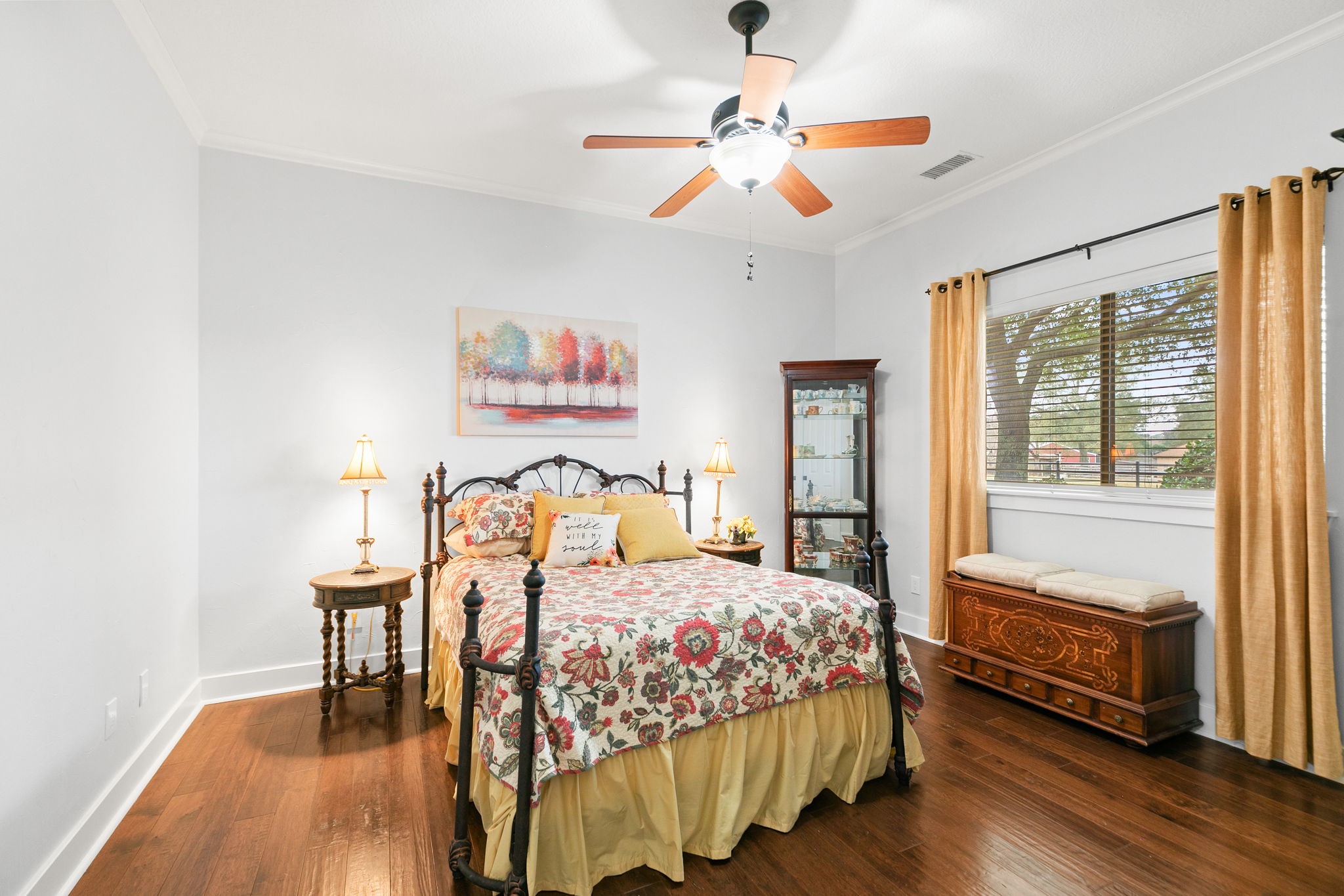 15601 Brown Road Tomball, TX 77377 - Photo 28 of 48 a bedroom with a bed and a table with wooden floor