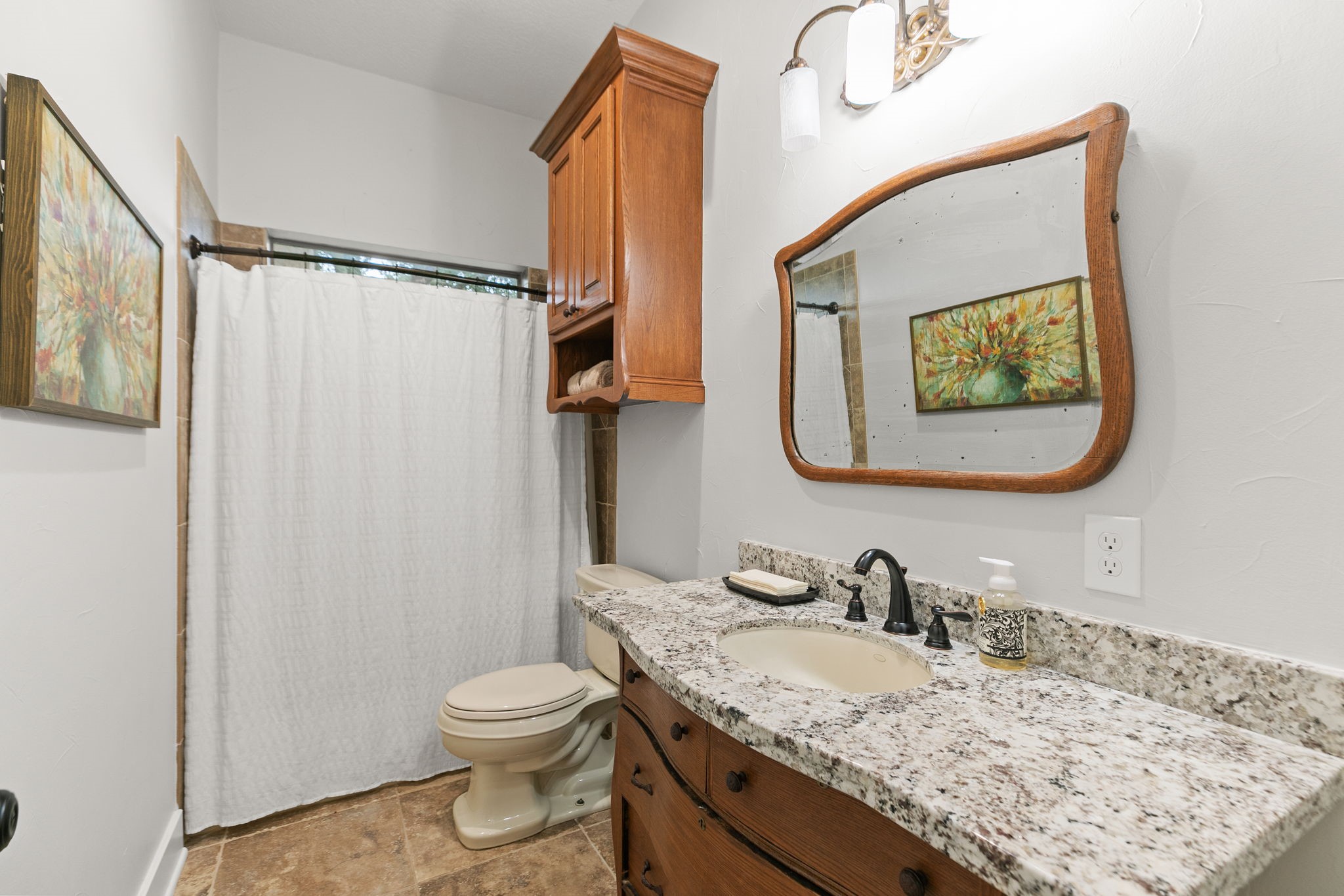 15601 Brown Road Tomball, TX 77377 - Photo 29 of 48 a bathroom with a granite countertop sink toilet and mirror