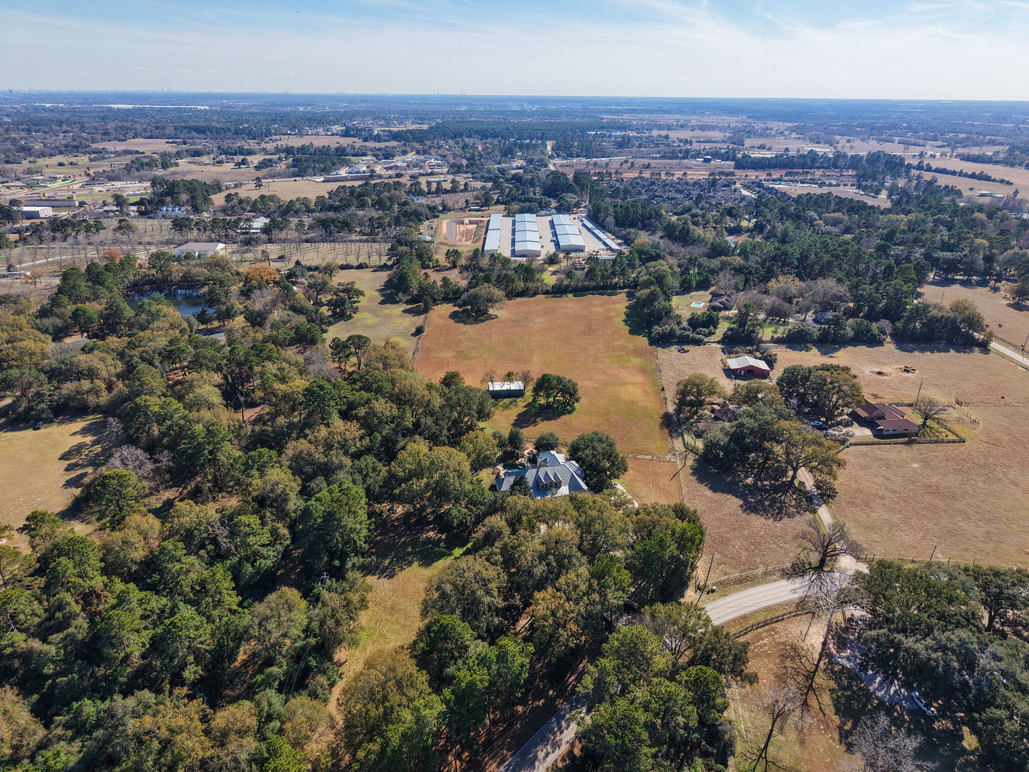 15601 Brown Road Tomball, TX 77377 - Photo 46 of 48 an aerial view of a city with lots of residential buildings