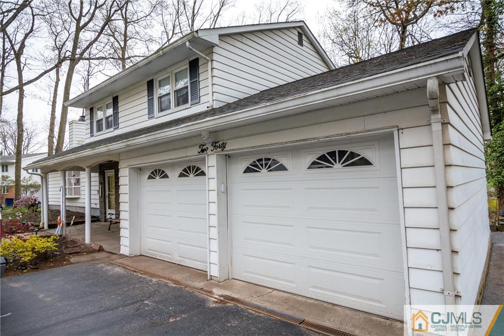 240 Hamlin Road North Brunswick, NJ 08902 - Photo 2 of 24 a view of a house with garage