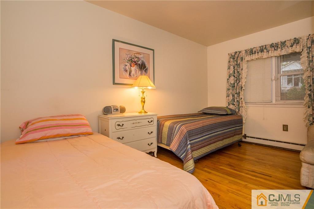 240 Hamlin Road North Brunswick, NJ 08902 - Photo 15 of 24 a bedroom with two beds and painting on the wall