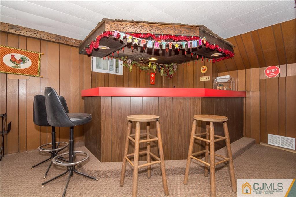 240 Hamlin Road North Brunswick, NJ 08902 - Photo 20 of 24 a view of a table and chairs in patio