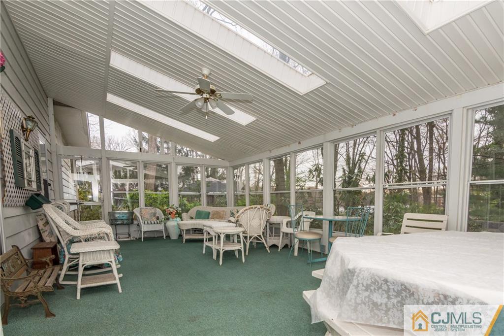 240 Hamlin Road North Brunswick, NJ 08902 - Photo 23 of 24 a room with lots of furniture and a large window