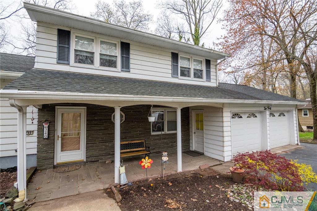 240 Hamlin Road North Brunswick, NJ 08902 - Photo 4 of 24 a view of a house with a garage
