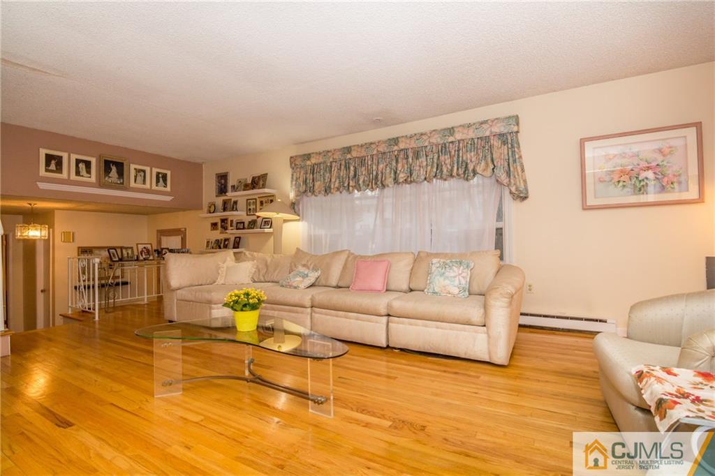 240 Hamlin Road North Brunswick, NJ 08902 - Photo 5 of 24 a living room with furniture and wooden floor