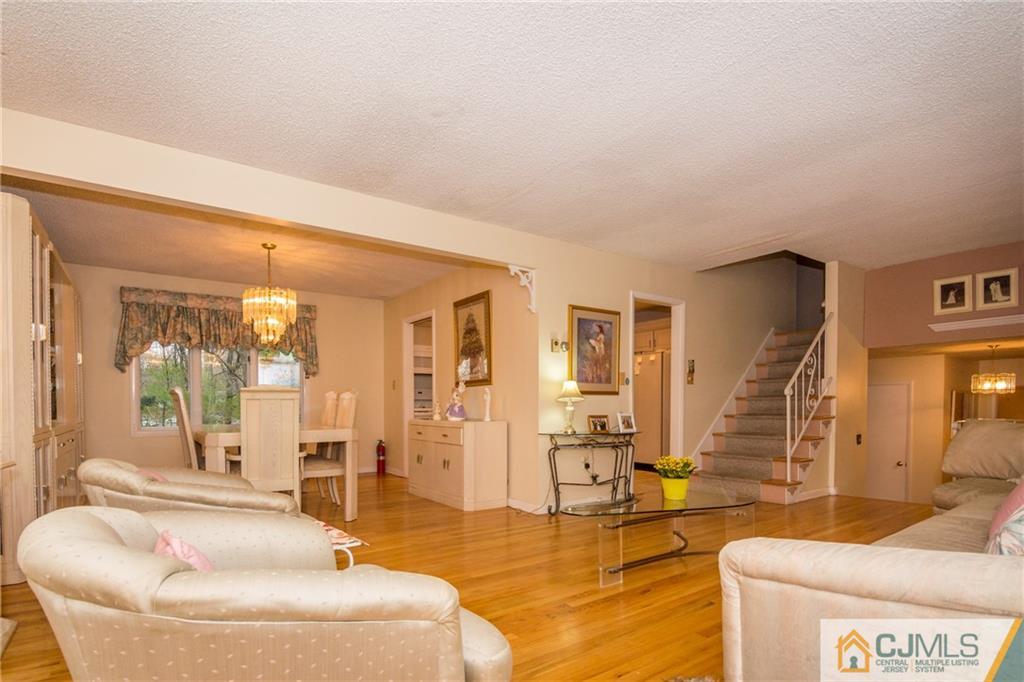 240 Hamlin Road North Brunswick, NJ 08902 - Photo 6 of 24 a living room with furniture and wooden floor