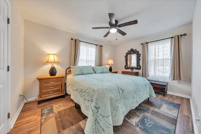 a bedroom with a bed and window