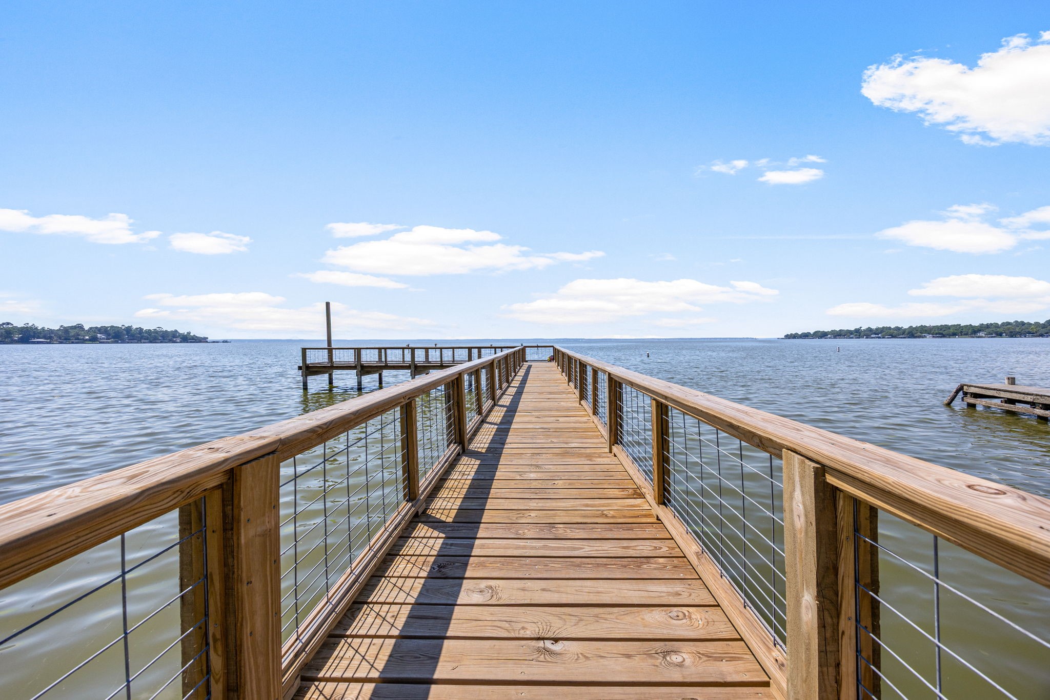 1100 Reveille Road Livingston, TX 77351 - Photo 4 of 20 a view of a balcony with wooden floor and fence
