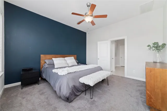 a bedroom with a bed and a table