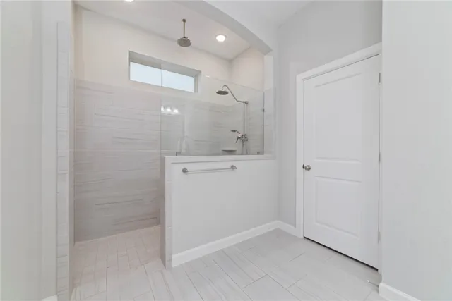 a bathroom with a sink a mirror and a shower