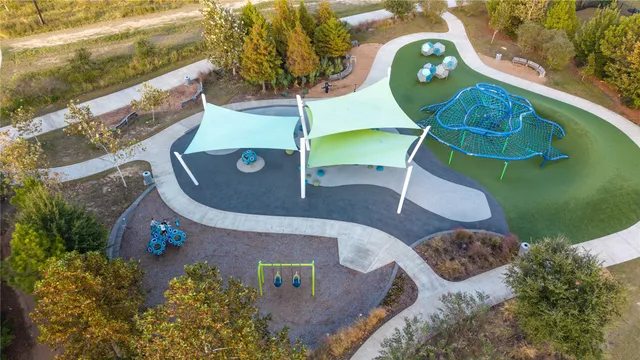 an aerial view of a house with a swimming pool