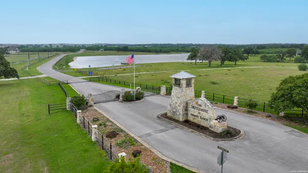 a view of a lake with a yard