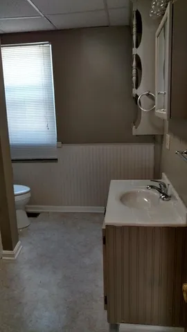 a bathroom with a sink and a toilet