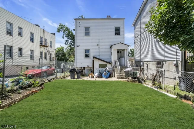 a front view of house with yard and outdoor seating