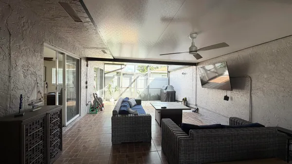 a living room with furniture and a large window