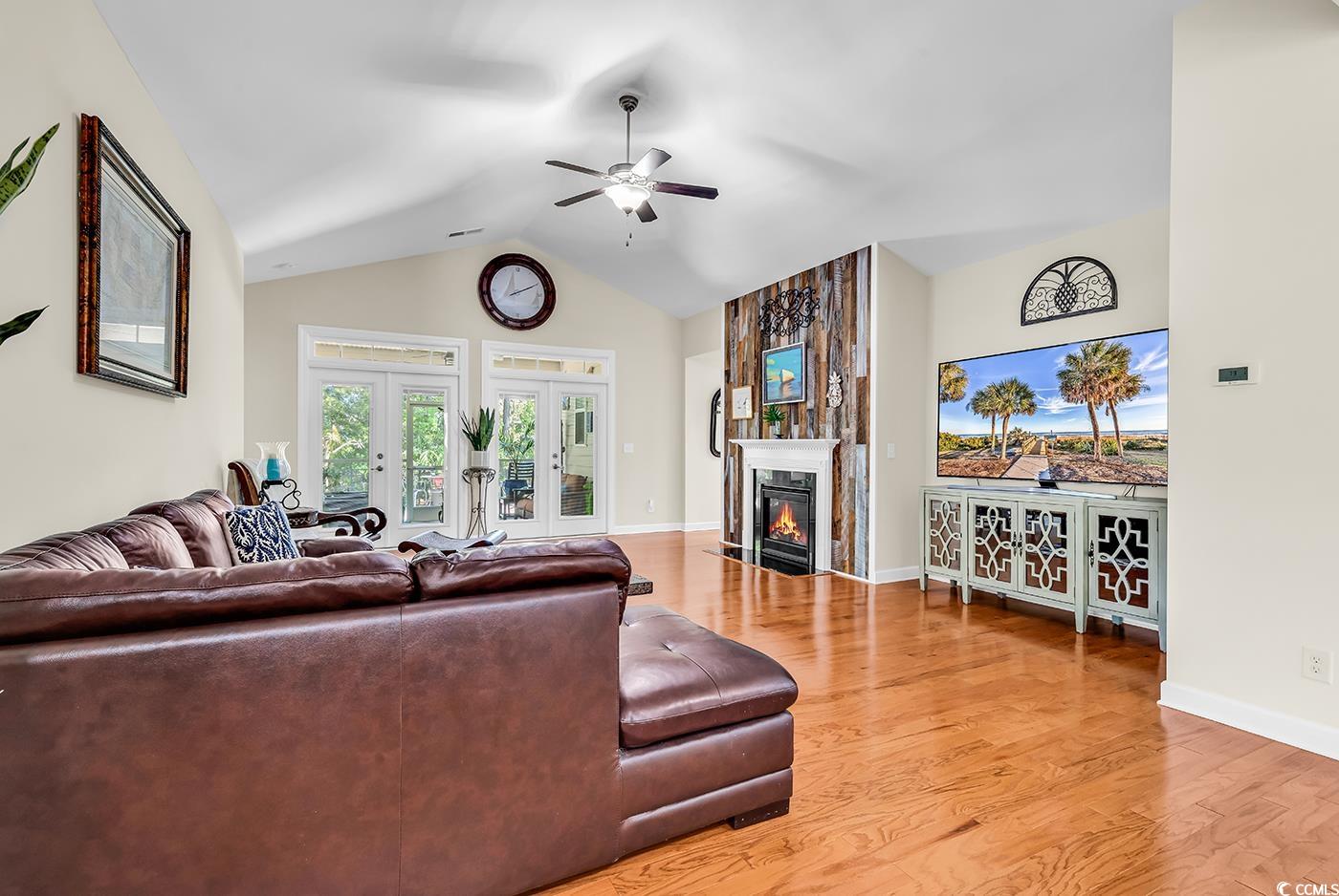 522 Heartland Court Murrells Inlet, SC 29576 - Photo 10 of 33 Living room featuring baseboards, vaulted ceiling,