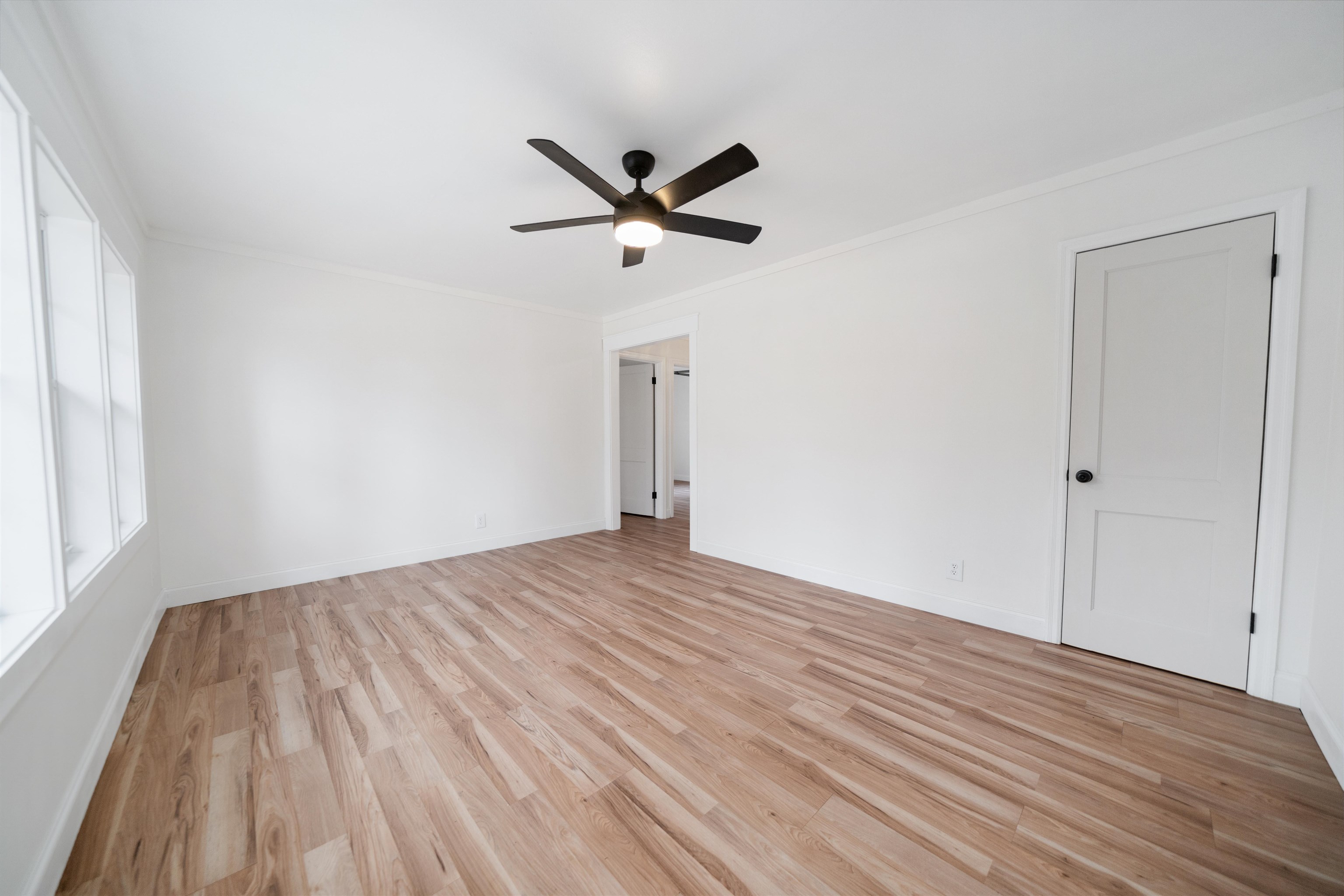 231 Adams Selmer, TN 38375 - Photo 16 of 24 a view of empty room with wooden floor and fan