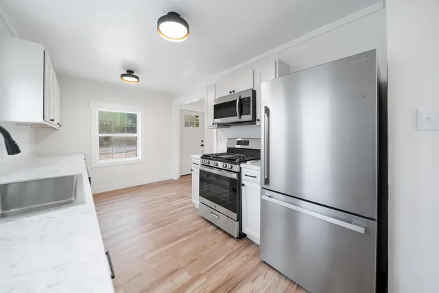 a view of an empty room with a window