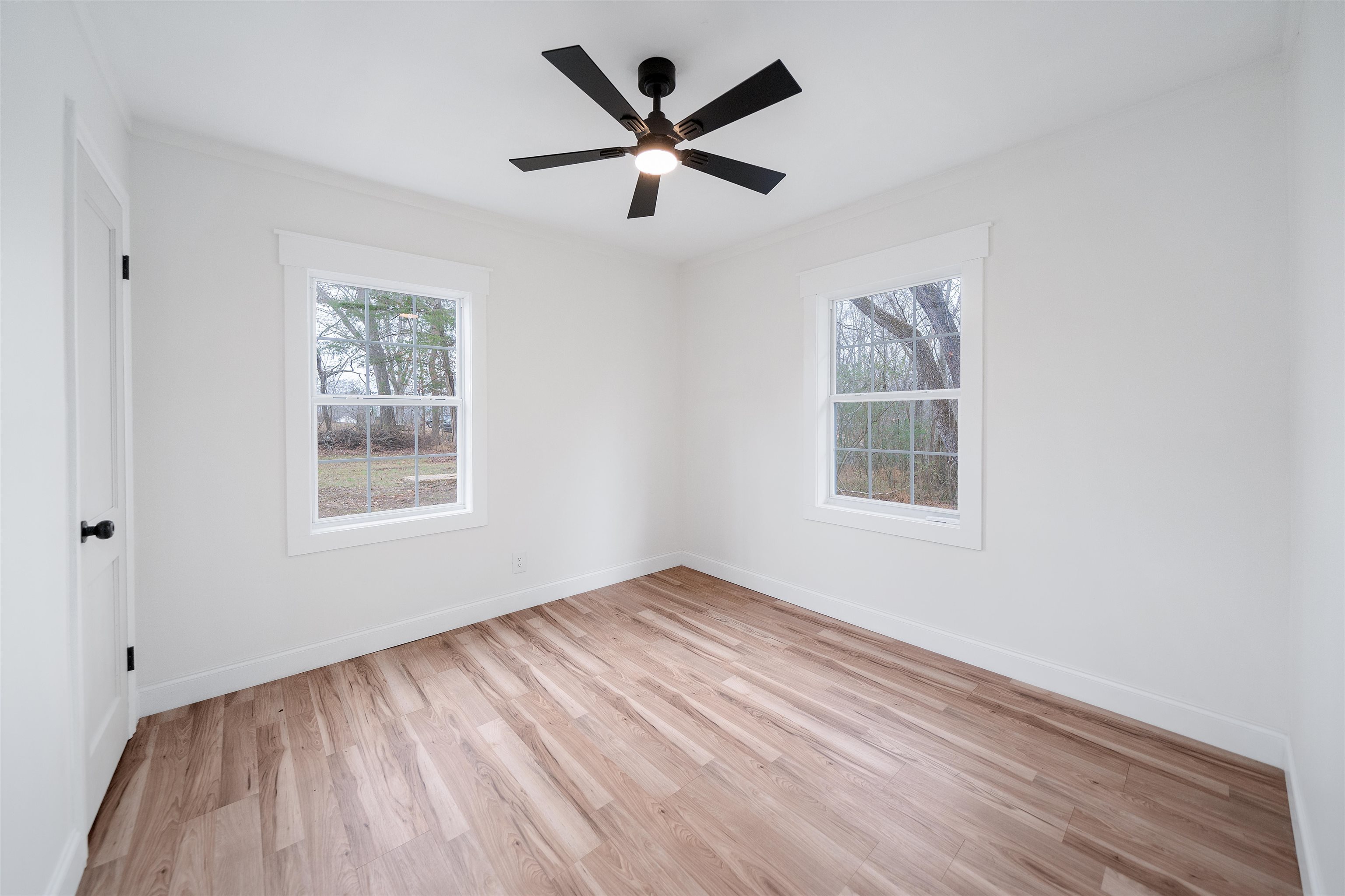 231 Adams Selmer, TN 38375 - Photo 22 of 24 a view of empty room with wooden floor and fan