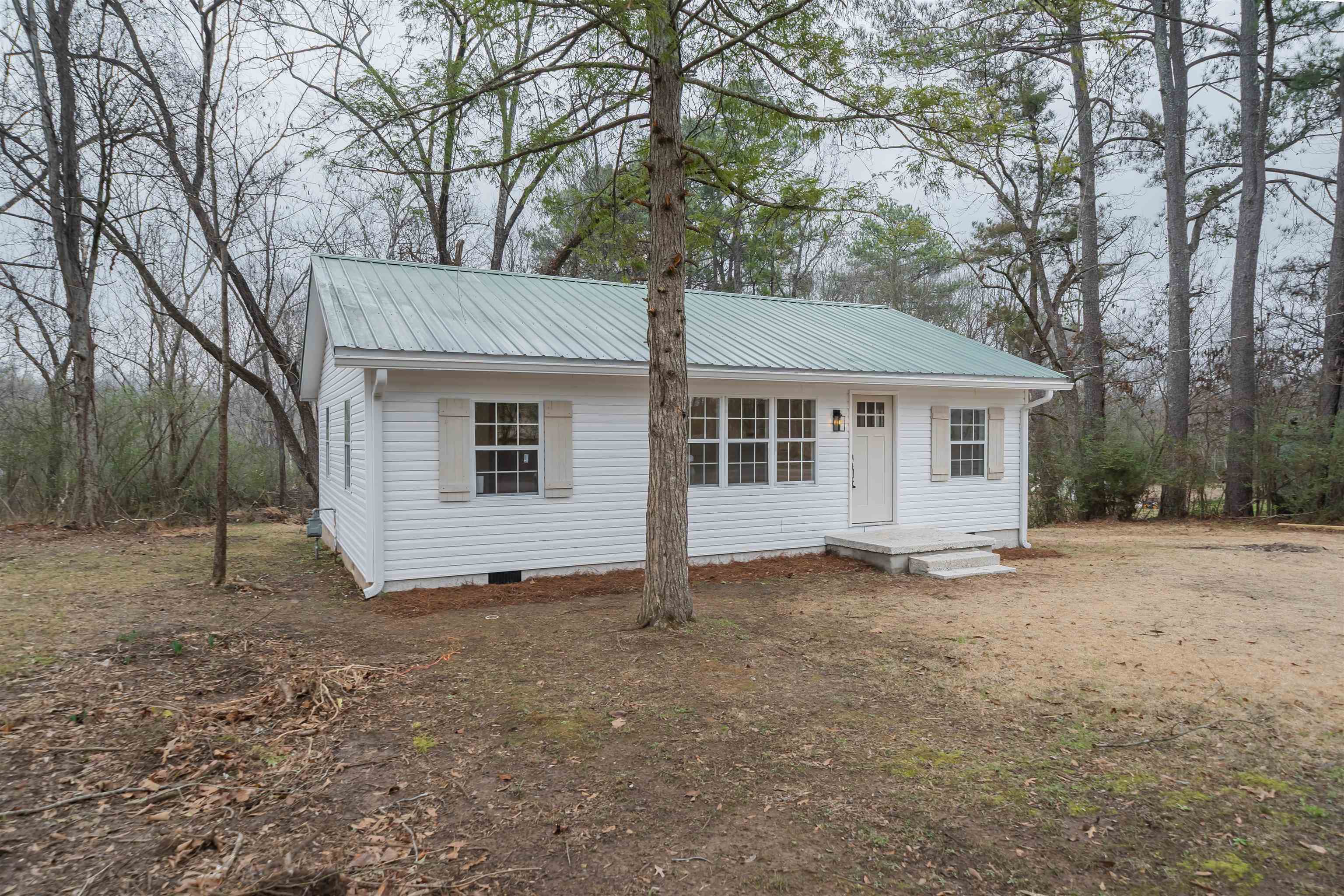 231 Adams Selmer, TN 38375 - Photo 3 of 24 a view of a house with a yard