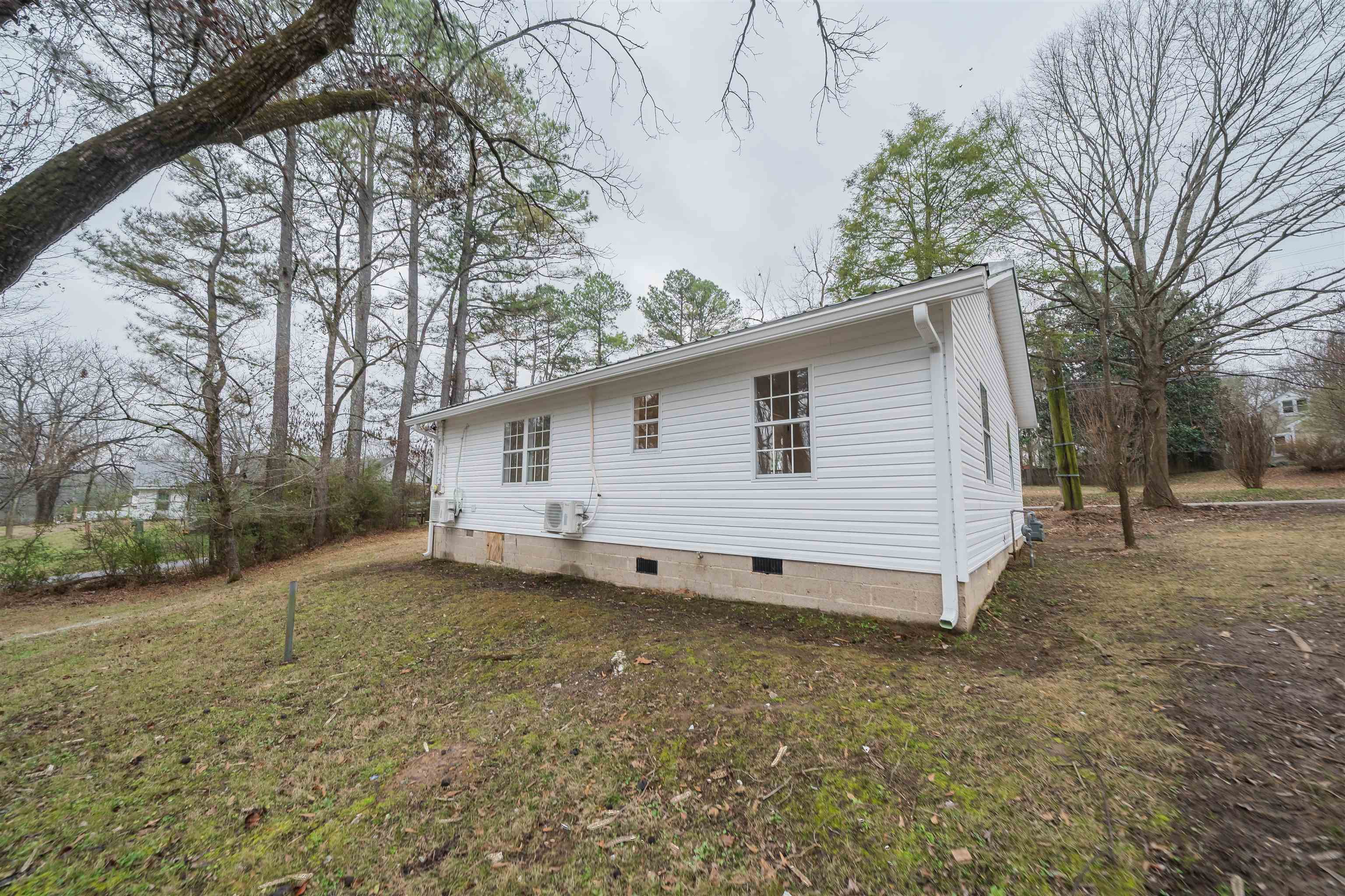 231 Adams Selmer, TN 38375 - Photo 6 of 24 a view of a house with a backyard and trees