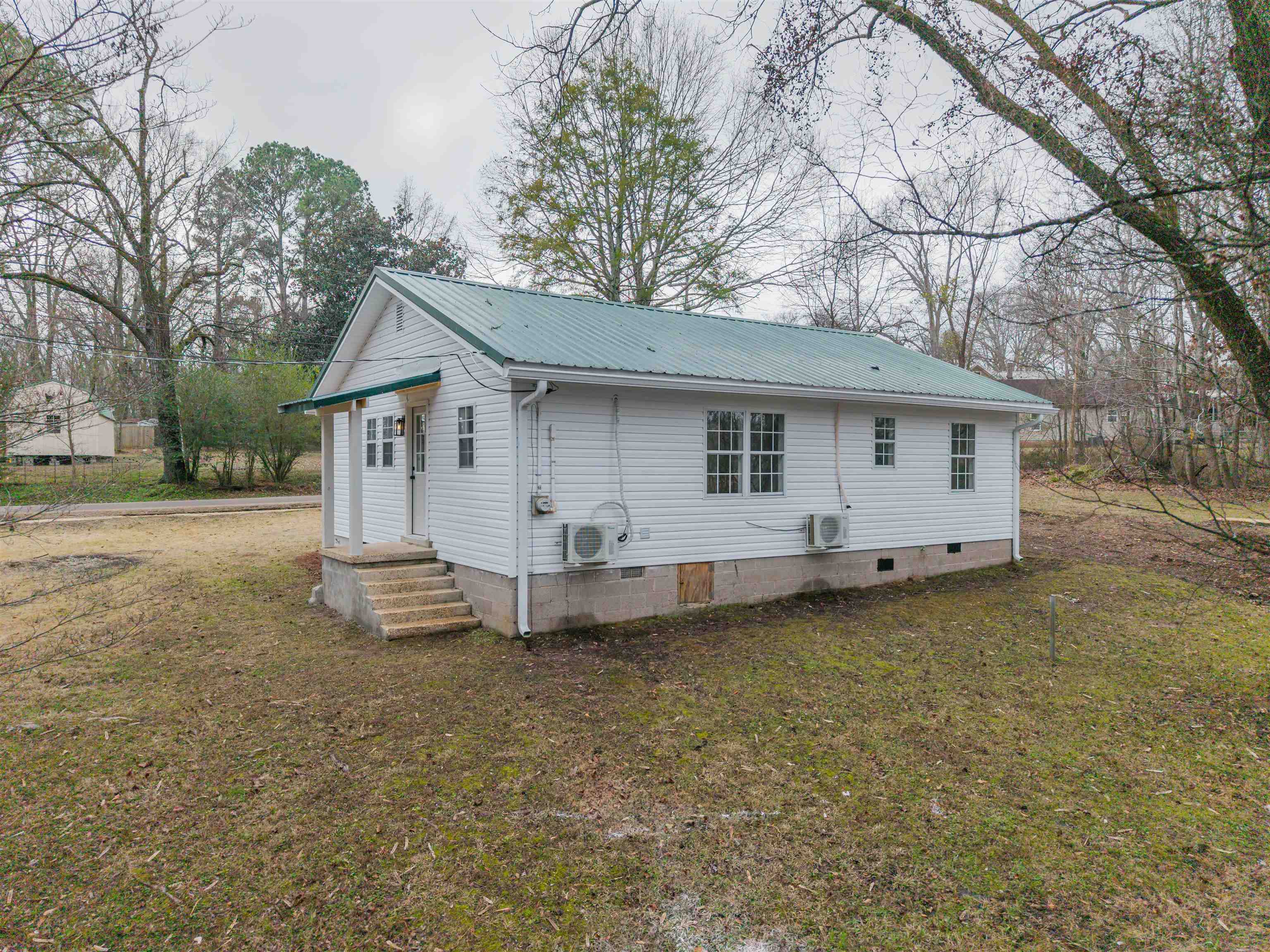 231 Adams Selmer, TN 38375 - Photo 8 of 24 a view of a house with a yard and sitting area