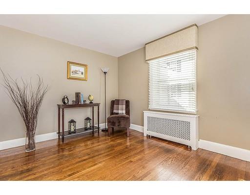 6 Philips Road Stoneham, MA 02180 - Photo 13 of 25 a living room with furniture and a table