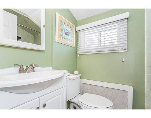 6 Philips Road Stoneham, MA 02180 - Photo 20 of 25 a bathroom with a sink a toilet and a mirror