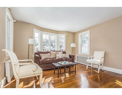 6 Philips Road Stoneham, MA 02180 - Photo 4 of 25 a living room with furniture and a wooden floor