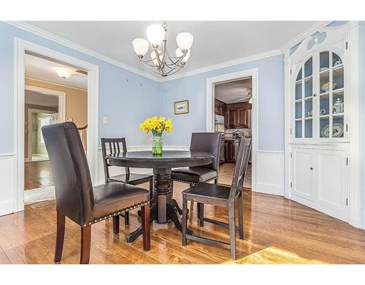 6 Philips Road Stoneham, MA 02180 - Photo 10 of 25 a view of a dining room with furniture and chandelier