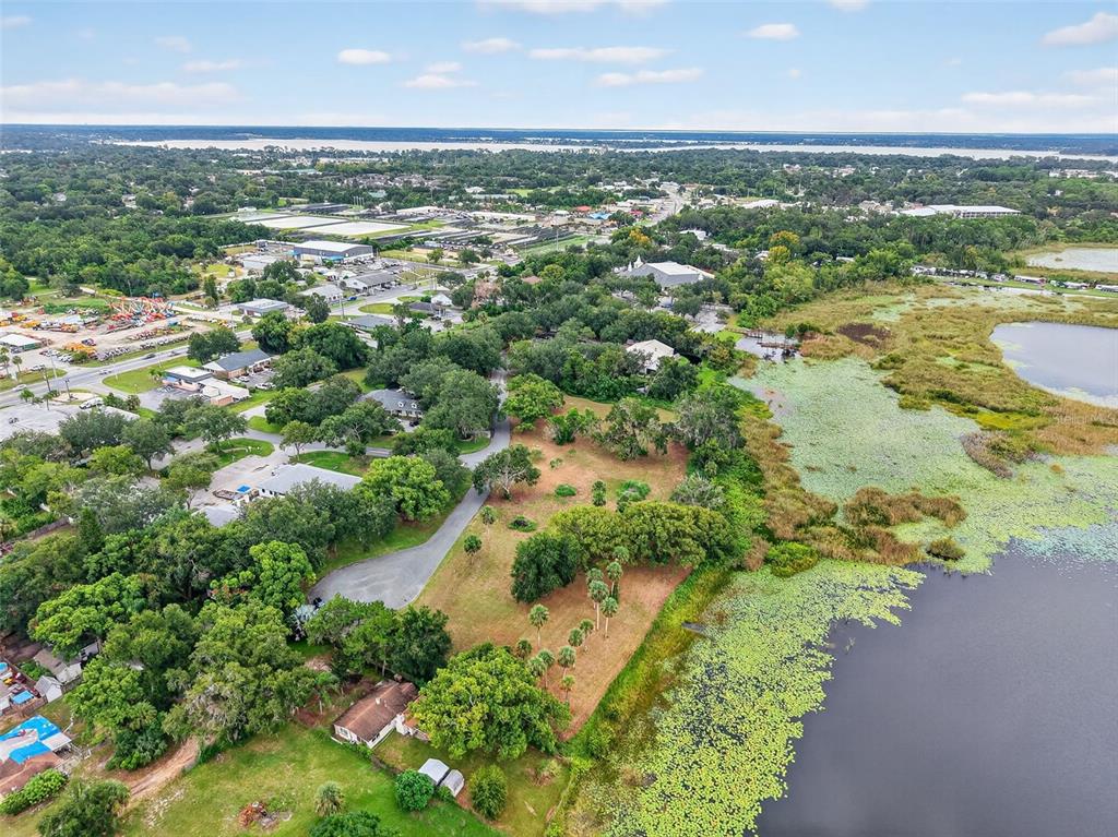 Amvets Way Mount Mount Dora, FL 32757 - Photo 12 of 15 an aerial view of residential houses with outdoor space and trees