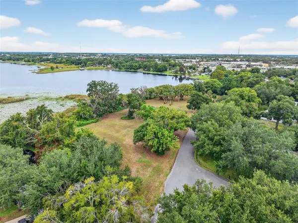 a view of a lake with a yard and lake view