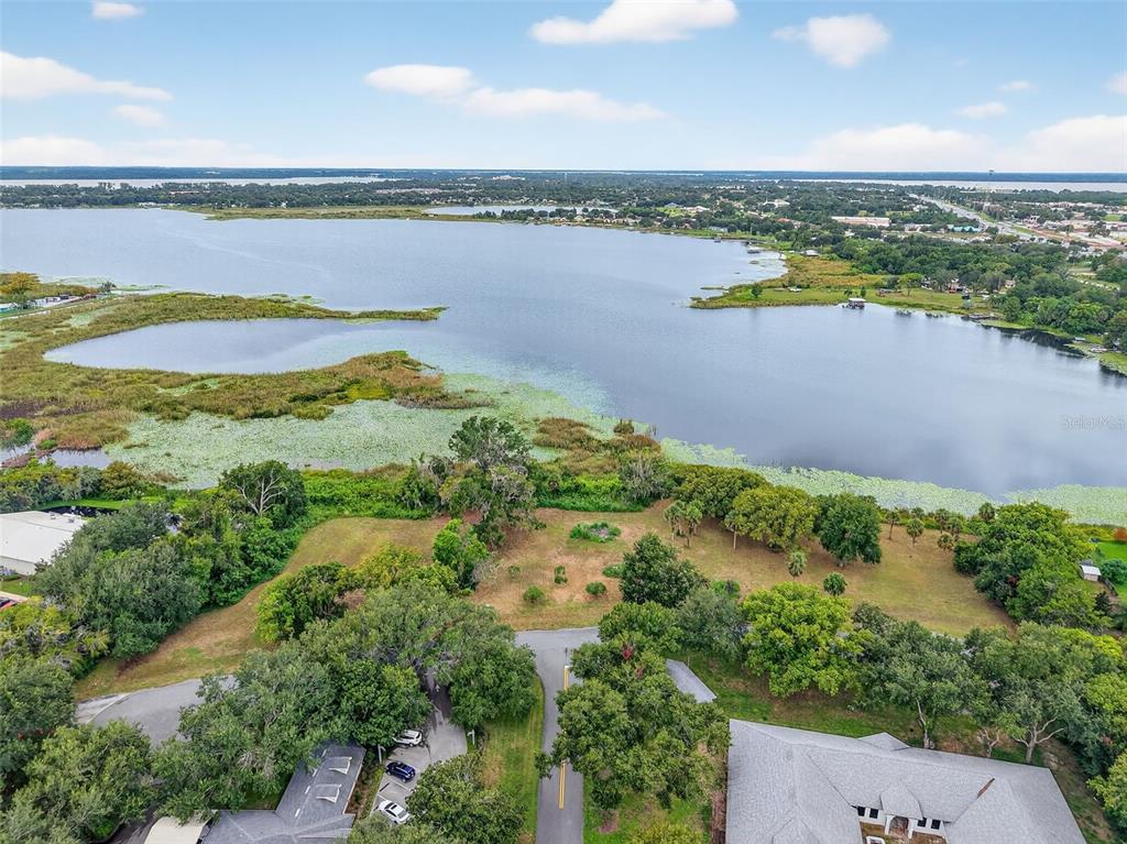 Amvets Way Mount Mount Dora, FL 32757 - Photo 2 of 15 a view of a lake with a city