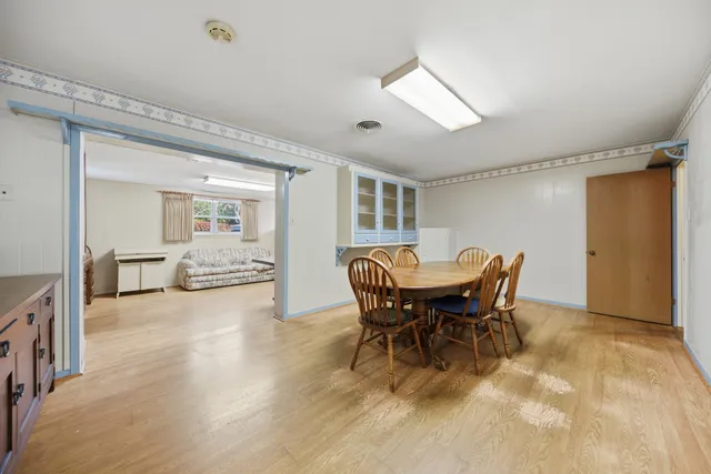 a view of a dining room with furniture and a livingroom