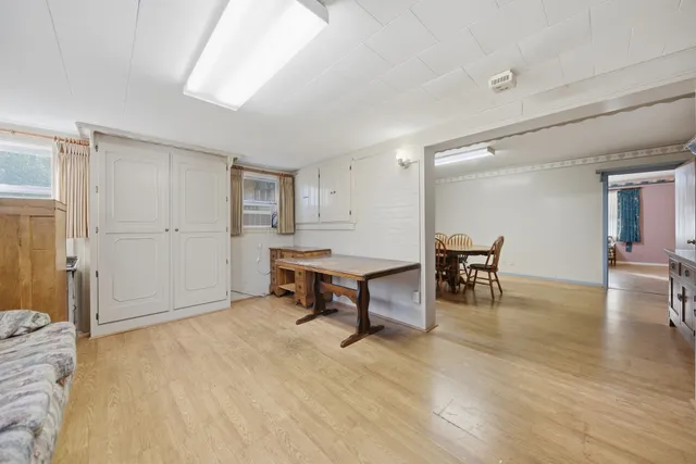 a view of a livingroom with furniture and wooden floor