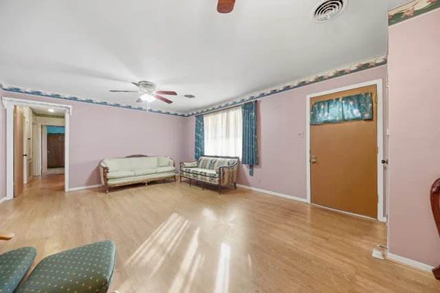 a view of a livingroom with furniture and a window
