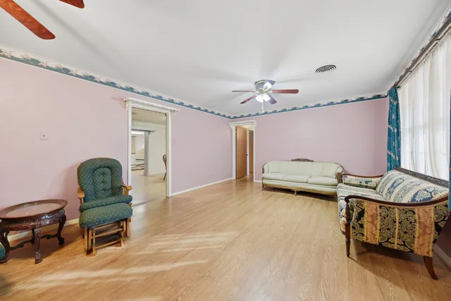 a bedroom with furniture and a chandelier