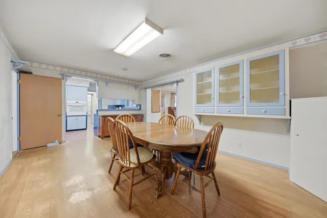 a view of a dining room with furniture and window