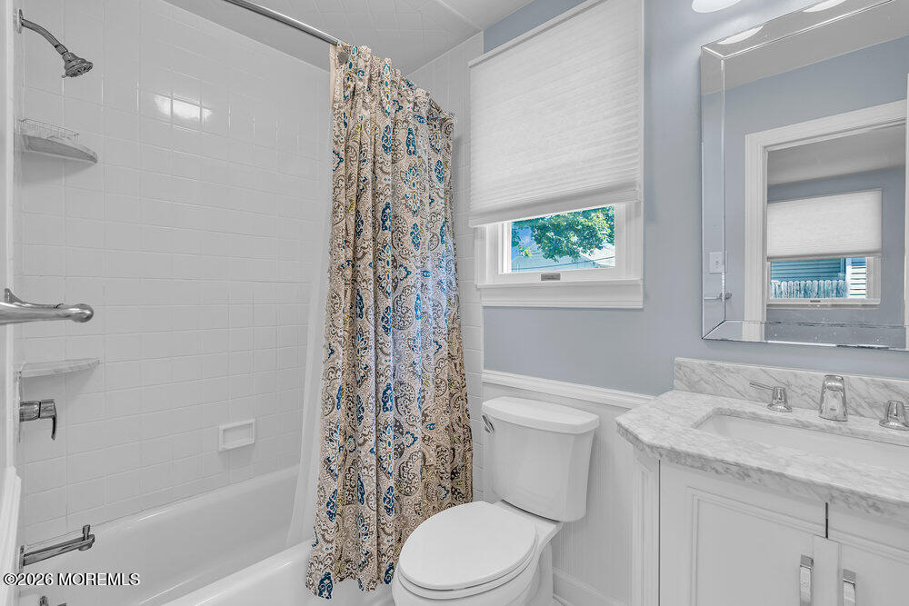 1407 Edgemere Road Wall, NJ 07719 - Photo 11 of 16 a bathroom with a granite countertop toilet a sink and a bathtub