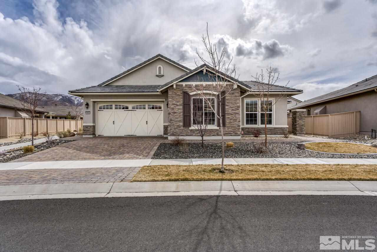 9950 Bernborough Drive Reno, NV 89521 - Photo 1 of 29 a front view of a house with a yard and garage