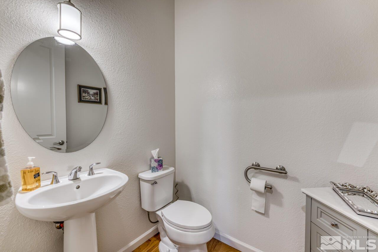 9950 Bernborough Drive Reno, NV 89521 - Photo 15 of 29 a bathroom with a sink toilet and a mirror