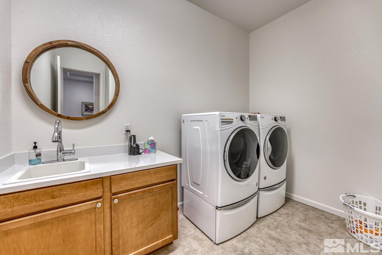 9950 Bernborough Drive Reno, NV 89521 - Photo 17 of 29 a utility room with sink dryer and washer
